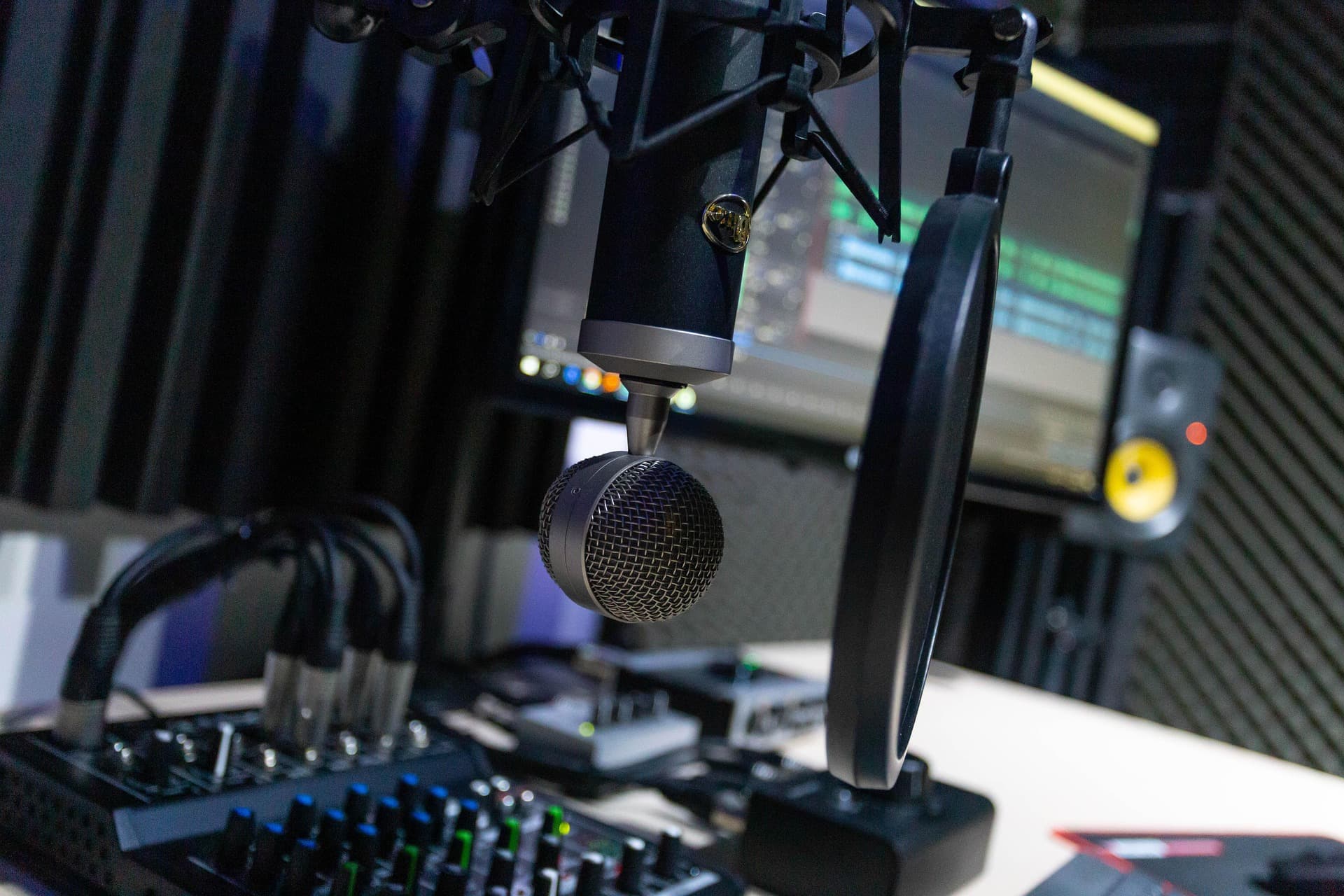Professional podcast production studio with microphone and audio equipment